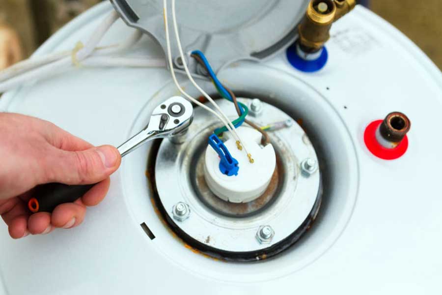 Technician repairing electric water heater